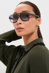 Woman wearing Pine Memphis Sunglasses with oversized square frames, effortlessly combining classic aviator style and ombre lenses for a high-end, fun, and chic look.