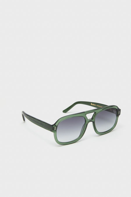 Pine Memphis Sunglasses in classic, oversized aviator style with translucent green frames and ombre lenses, blending effortless fun with high-end fashion.