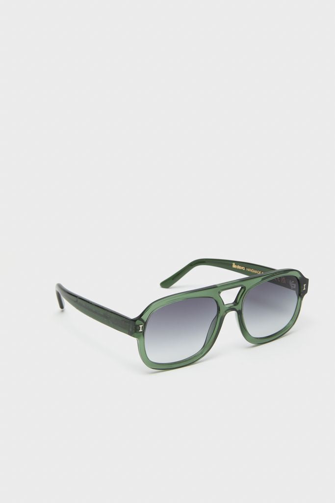Pine Memphis Sunglasses in classic, oversized aviator style with translucent green frames and ombre lenses, blending effortless fun with high-end fashion.