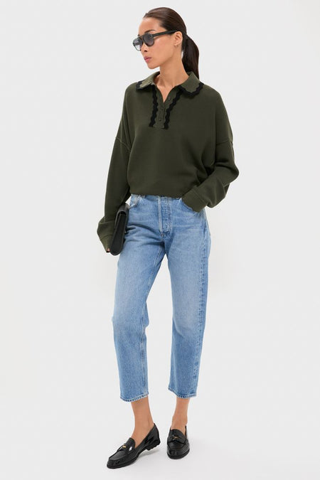 Woman wearing Pine Memphis Sunglasses, classic oversized aviators, paired with an effortless outfit. She's embodying a high-end, fun style with a sleek clutch and loafers.