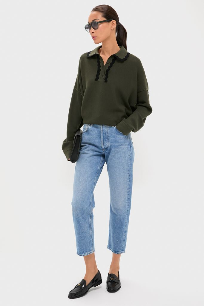 Woman wearing Pine Memphis Sunglasses, classic oversized aviators, paired with an effortless outfit. She's embodying a high-end, fun style with a sleek clutch and loafers.