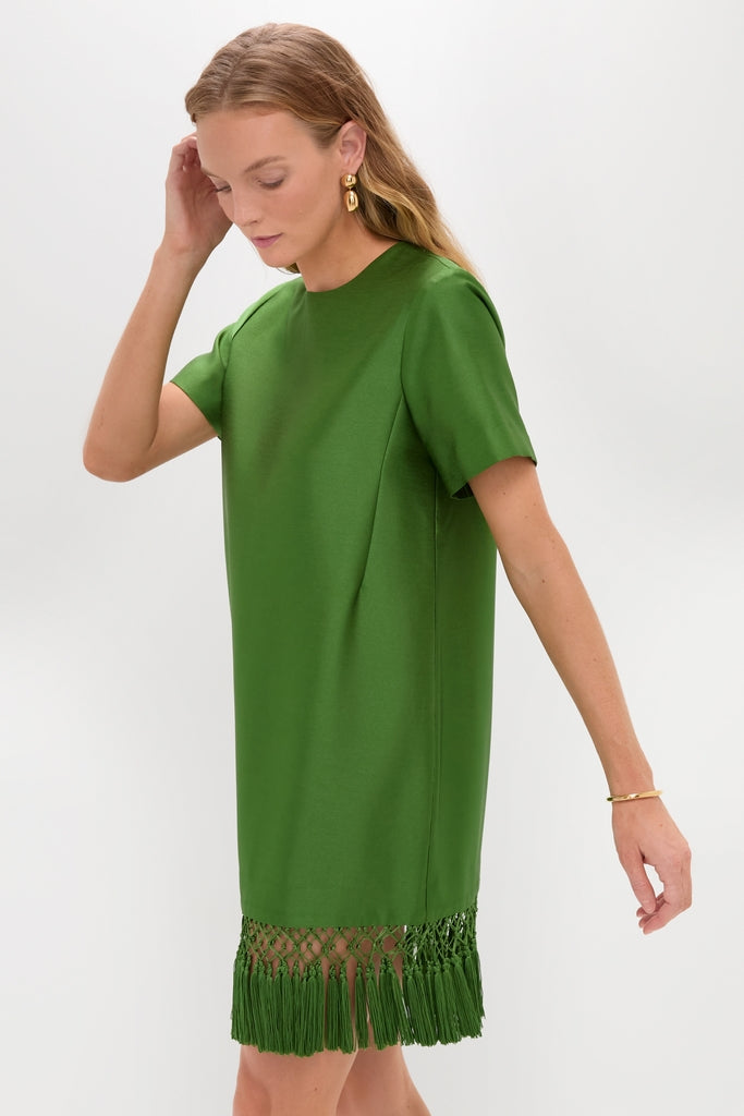 Green Tassel Downing Dress: A classic, effortless mini with a fun fringe hem, perfect for high-end holiday gatherings. Features a sleek shift silhouette and elegant accessories.