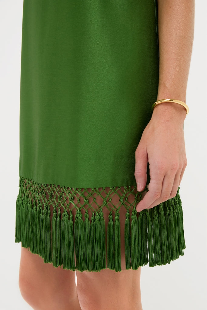 Green Tassel Downing Dress with a classic knotted fringe hem and flirty tassels, paired with an effortless gold bangle for a fun, high-end look.