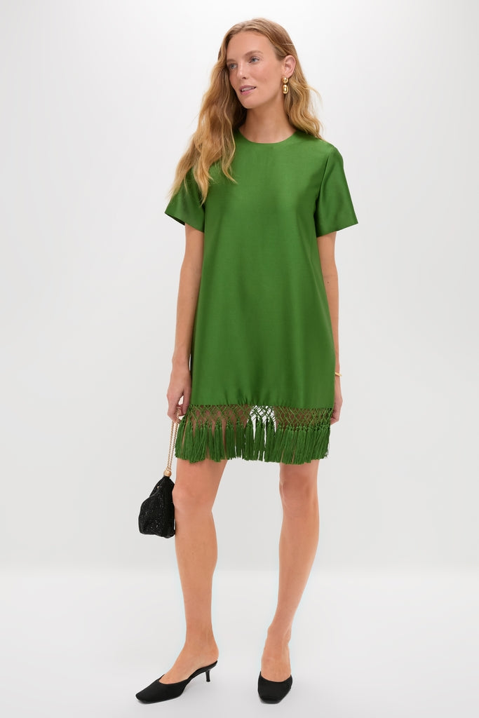 Green Tassel Downing Dress: A classic, shift-style mini in vibrant green with macramé fringe, exuding effortless, high-end fun, paired with black mules and a chic beaded pouch.