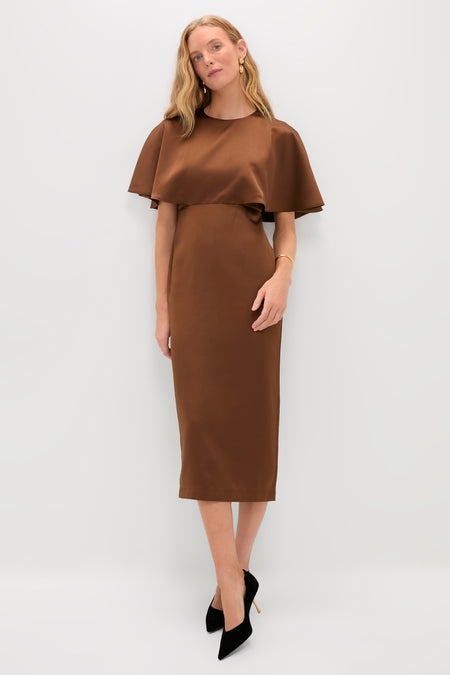Model in Chocolate Brown Cape Leah Dress with flowing overlay, styled with pointed-toe black pumps. A classic, effortless look that embodies high-end fashion and fun.