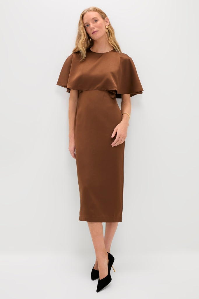 Model in Chocolate Brown Cape Leah Dress with flowing overlay, styled with pointed-toe black pumps. A classic, effortless look that embodies high-end fashion and fun.