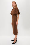 Model wearing the Chocolate Brown Cape Leah Dress, featuring classic cape-style sleeves and paired with black stiletto pumps and gold accessories, embodying effortless high-end style.