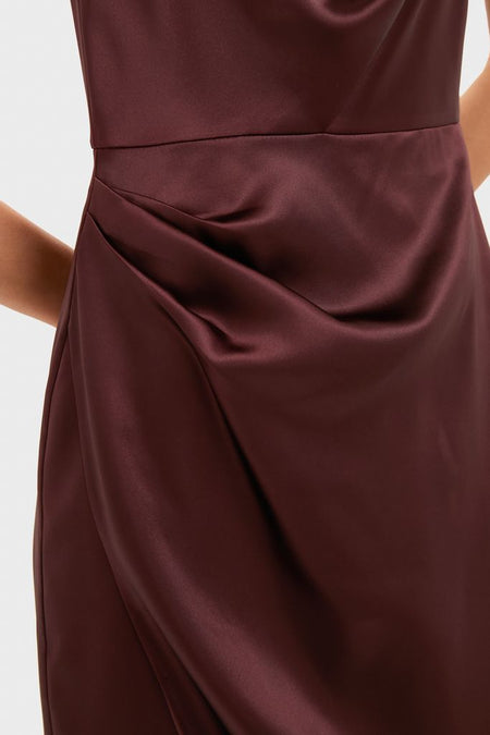 Effortless and classic, the Chocolate Satin Sinclair Dress features an asymmetrically draped skirt and luxurious satin, perfect for high-end, fun holiday events.