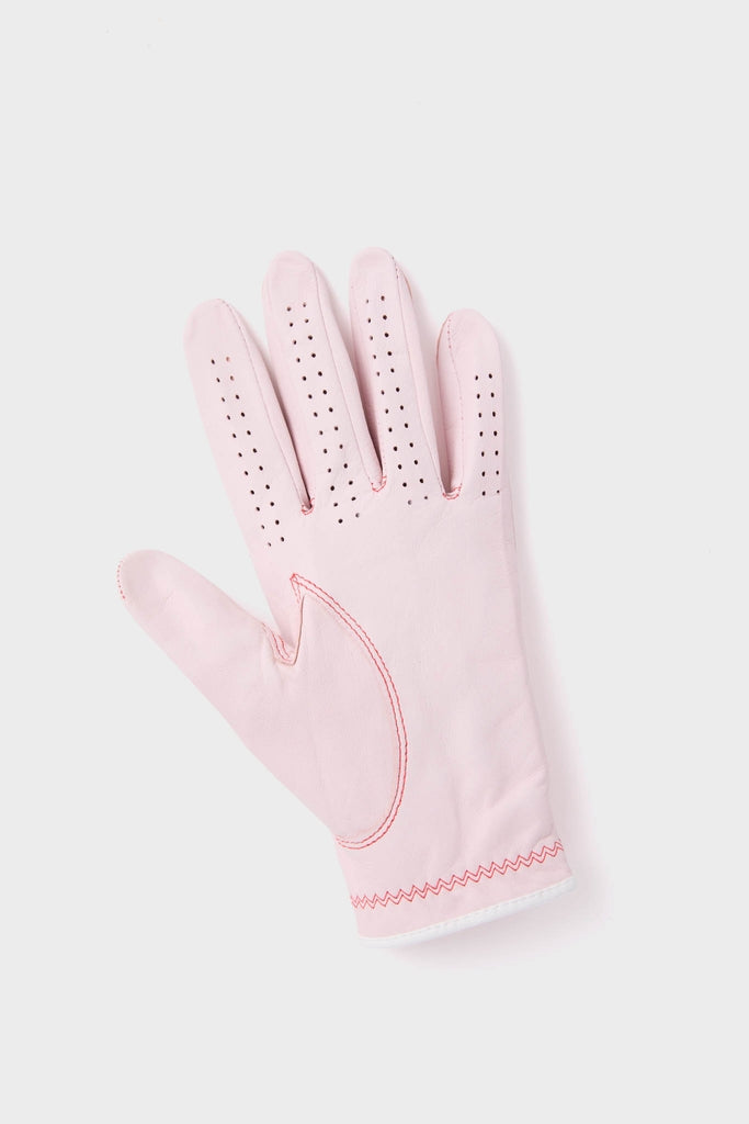 Classic Pink Left Hand Golf Glove, featuring soft material, ventilation holes, red contrast stitching on the thumb, and a zig-zag detail on the cuff for effortless, high-end style.