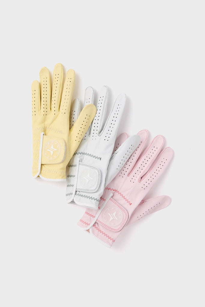 Classic and effortless Pink Left Hand Golf Glove with Velcro strap and ventilation, perfect for a fun and high-end golfing experience.