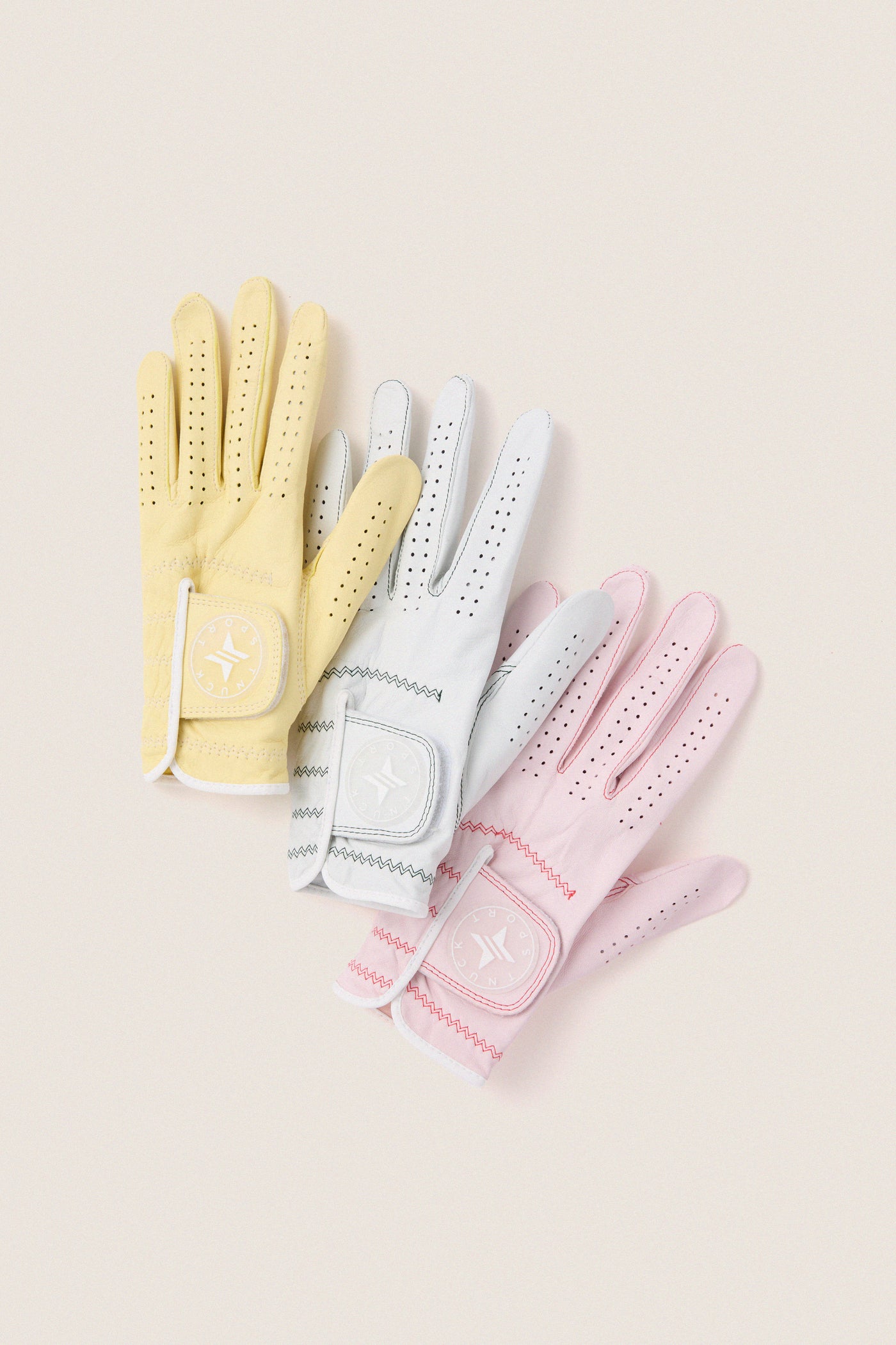 Yellow Left Hand Golf Glove with classic perforated design and Velcro strap, offering effortless comfort and fun flexibility for an elevated swing experience.