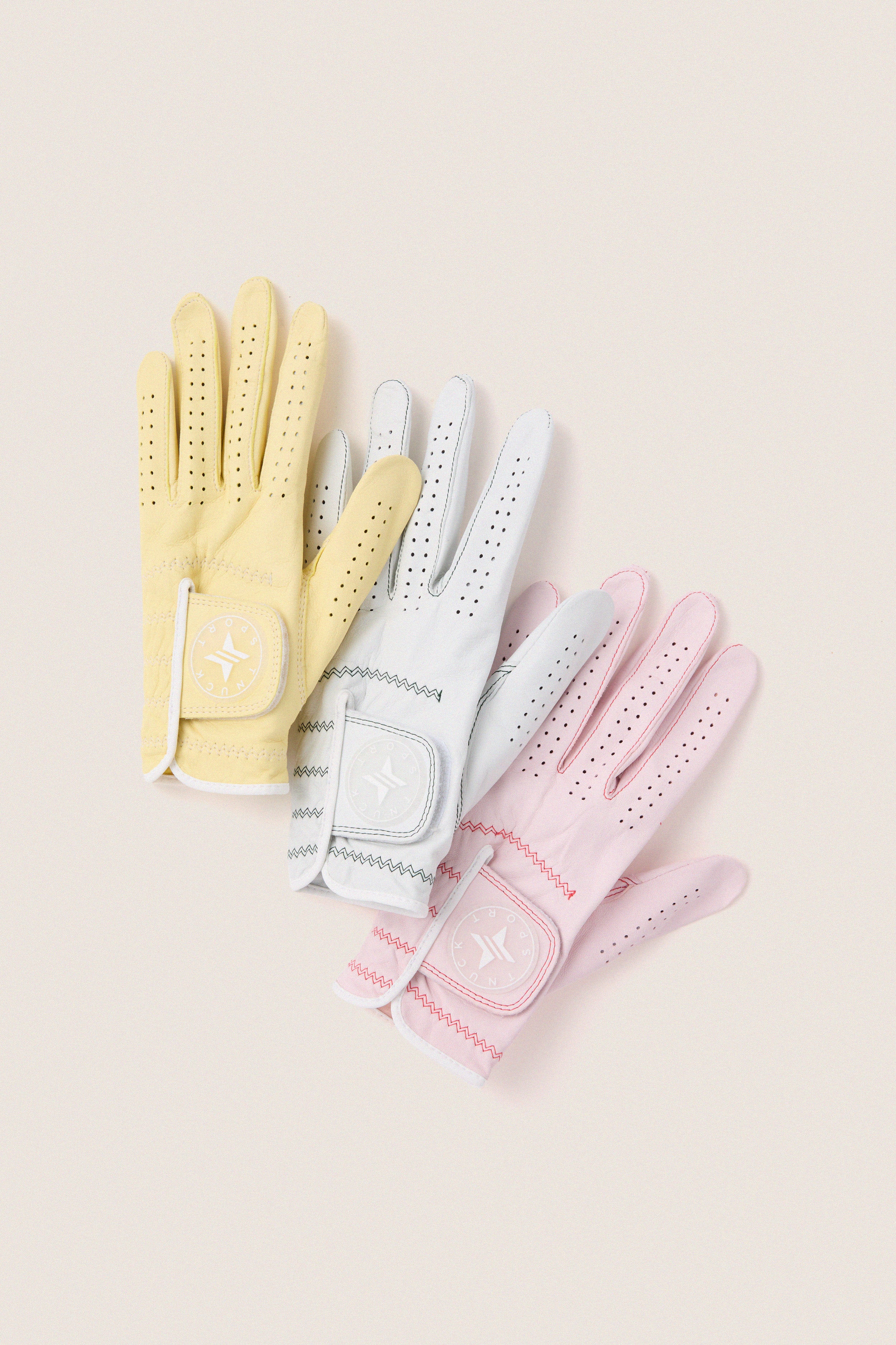 Yellow Left Hand Golf Glove with classic perforated design and Velcro strap, offering effortless comfort and fun flexibility for an elevated swing experience.