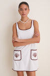 Blanc Shell Embroidered Terrycloth Dress Coverup features a classic, effortless shift silhouette with fun shell motifs and high-end brown trim, perfect for versatile summer outings.