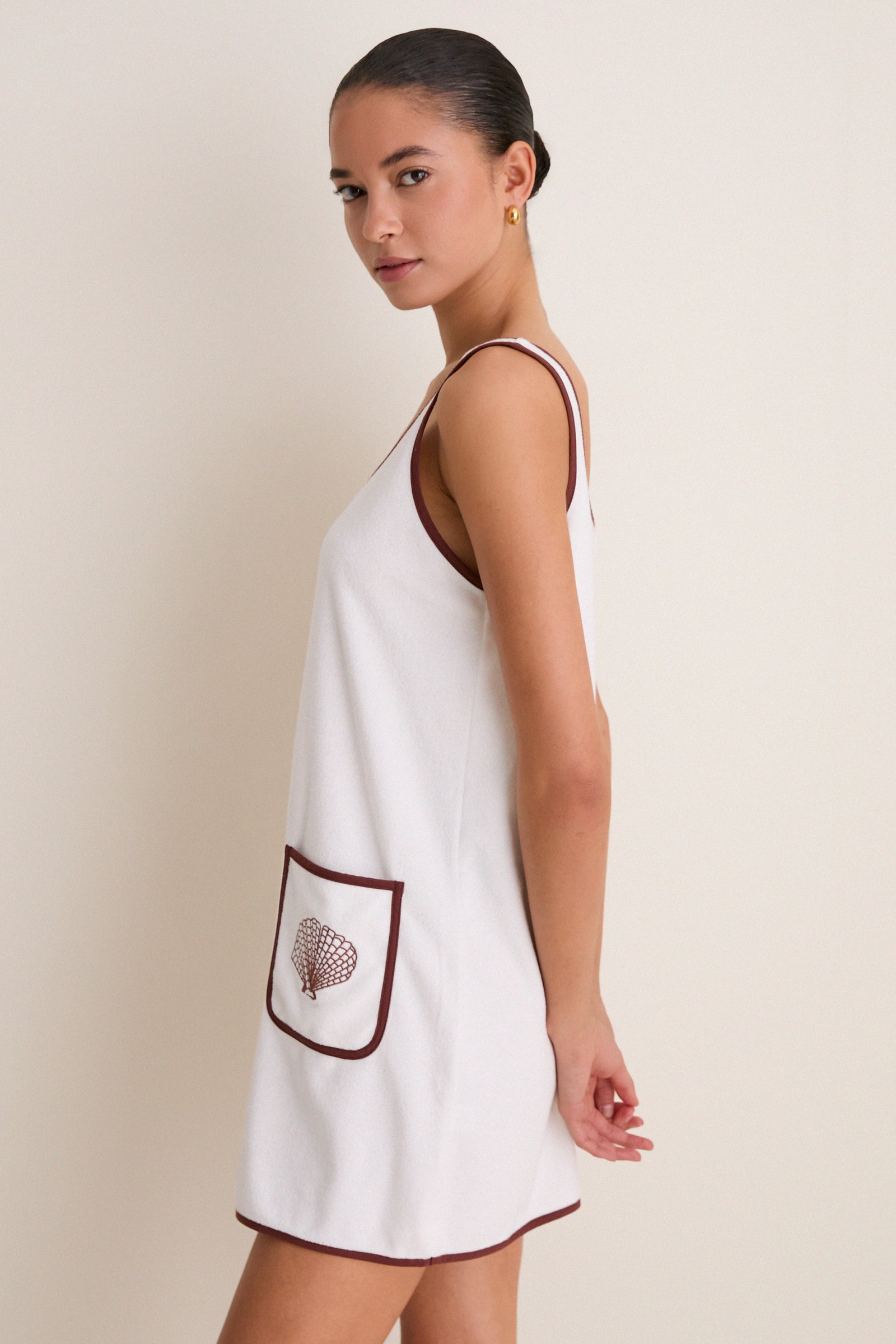 Blanc Shell Embroidered Terrycloth Dress Coverup features an effortless, classic shift silhouette with chic brown trim and shell embroidery, perfect for fun, high-end beach-to-barbecue style.