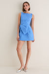 Blue Jacquard Briallen Bow Mini Dress: A classic, high-end sleeveless dress with an effortless boat neckline and fun oversized bow, paired with metallic slingback heels. Perfect for elevated occasions.