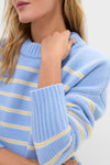 Woman wearing the classic Chambray, Butter and Cream Fineline Stripe Marin Sweater, a chunky knit with playful stripes, highlighting effortless, high-end style with a relaxed, fun fit.