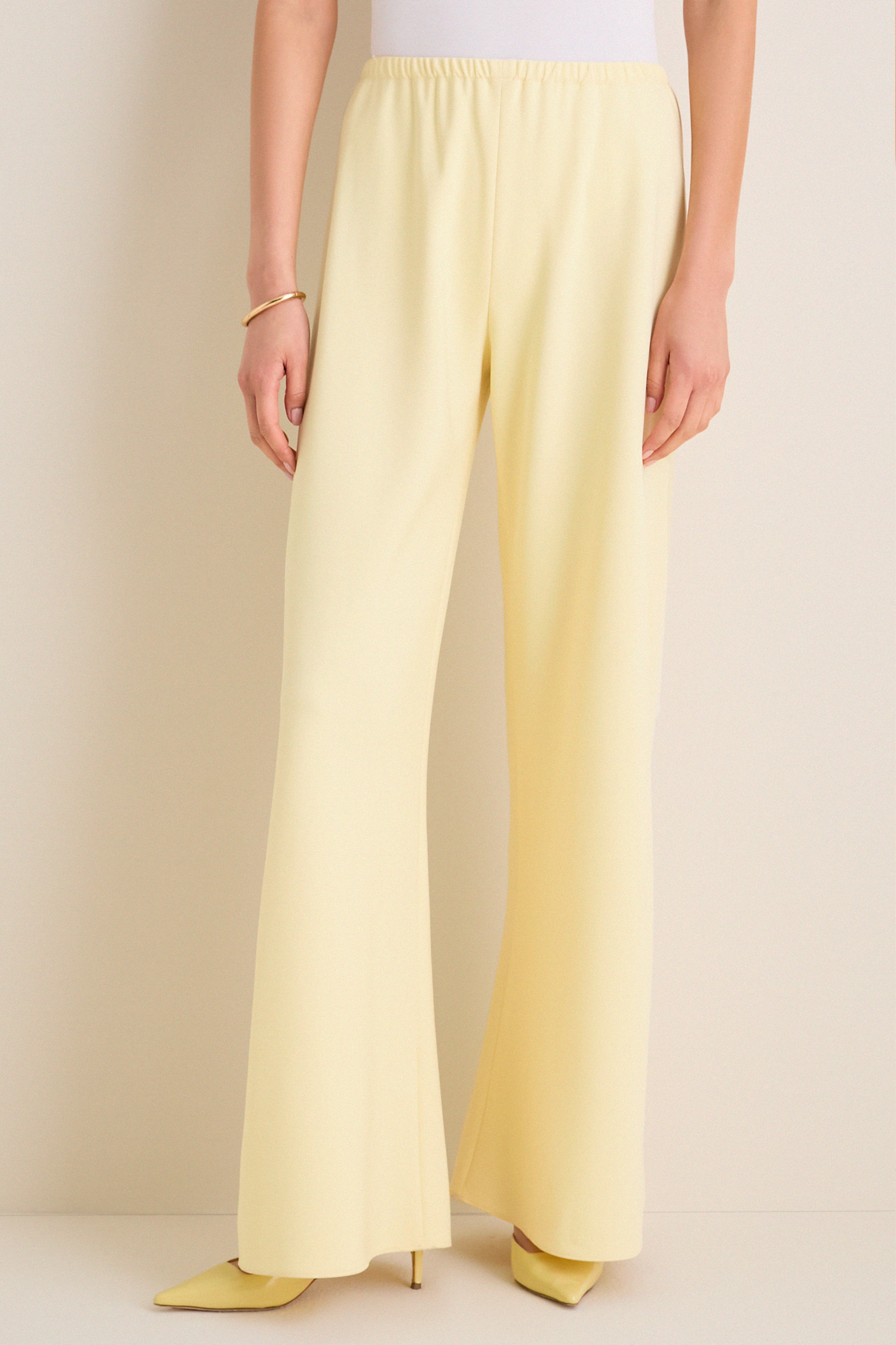 Butter Crepe Colby Pant, showcasing classic wide-leg style and effortless elegance, paired with matching heels and a gold bangle for a fun, high-end look.