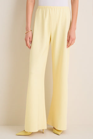 Butter Crepe Colby Pant, showcasing classic wide-leg style and effortless elegance, paired with matching heels and a gold bangle for a fun, high-end look.