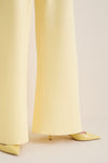 Butter Crepe Colby Pant: Classic wide-leg trousers with an effortless, high-end style, paired with matching stiletto heels for a fun, elevated look.