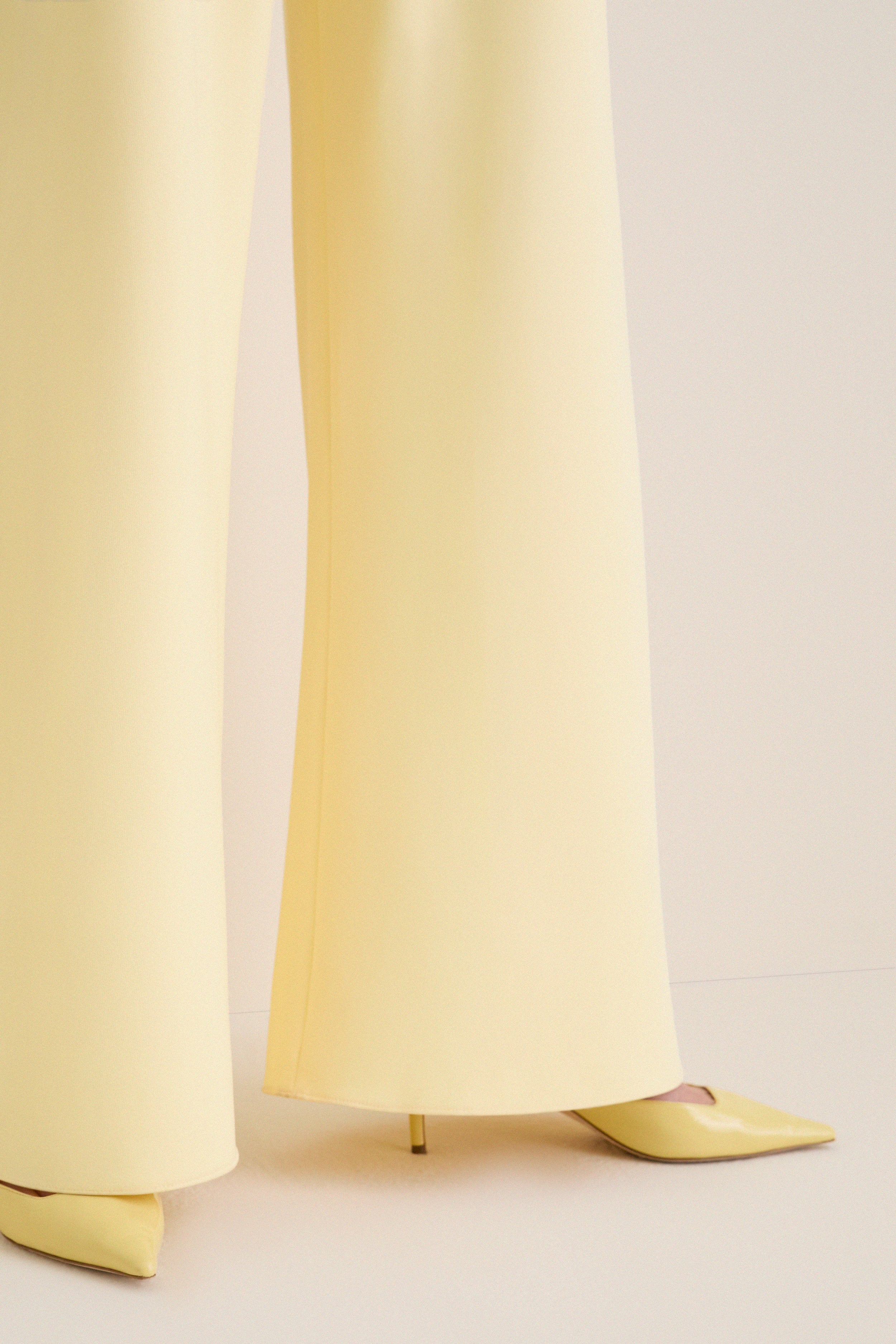 Butter Crepe Colby Pant: Classic wide-leg trousers with an effortless, high-end style, paired with matching stiletto heels for a fun, elevated look.