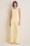 Woman in classic, effortless Butter Crepe Colby Pant and top, showcasing high-end, fun style with a flattering straight leg and elastic waistband, embodying Tuckernuck's chic confidence.
