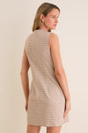 Woman modeling the Mocha Gingham Yvette Mini Dress, showcasing its classic, sleeveless design and effortless vibe, perfectly embodying Tuckernuck's fun and high-end style.