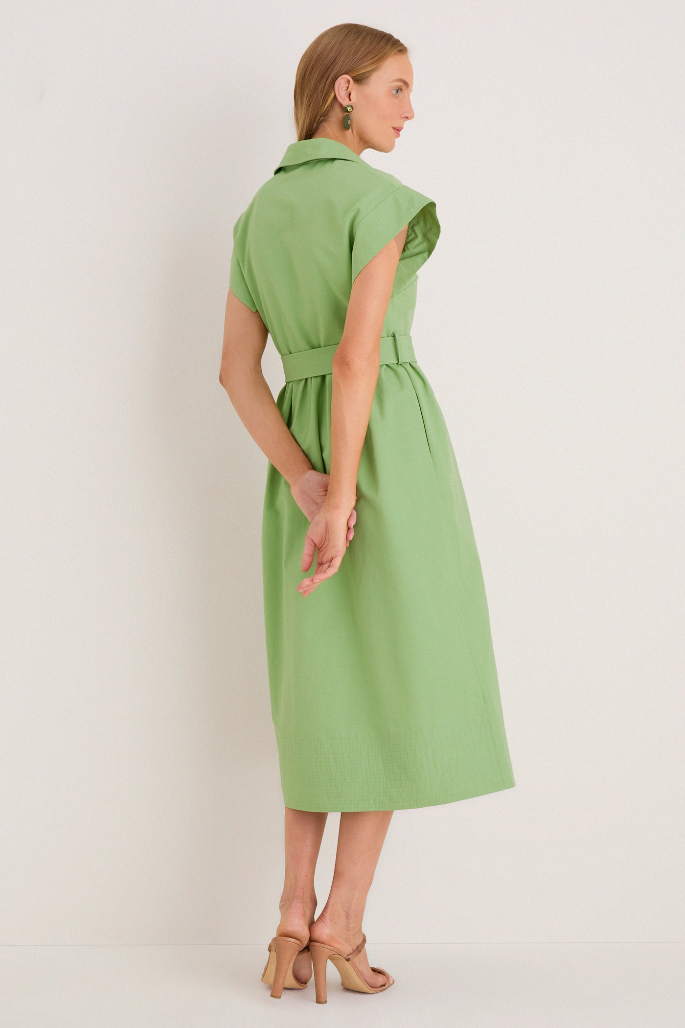 Pistachio Chloe Dress: A classic, sleeveless shirt-dress with a fabric belt, creating an effortless, high-end look, paired with open-toed tan heels for fun sophistication.