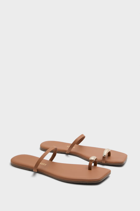 Au Naturale Colette Sandals: Classic, effortless flat slides with a fun gold-accented toe-loop, square-toe silhouette, and cushioned insole. High-end design handcrafted in Brazil.