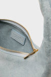 Classic Baby Blue Gnocchi Bag in suede with a gold zipper, showcasing effortless and high-end style. Perfect for a fun, versatile, and polished everyday look.