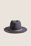 Navy and Tan Fringed Pammy Panama Continental Hat, a classic and effortless woven straw design with a playful fringe brim and tan leather band, perfect for fun, high-end sun-ready adventures.