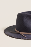 Navy and Tan Fringed Pammy Panama Continental Hat: A classic, effortless straw hat with a fun fringe brim and high-end leather band, perfect for sun-filled adventures.