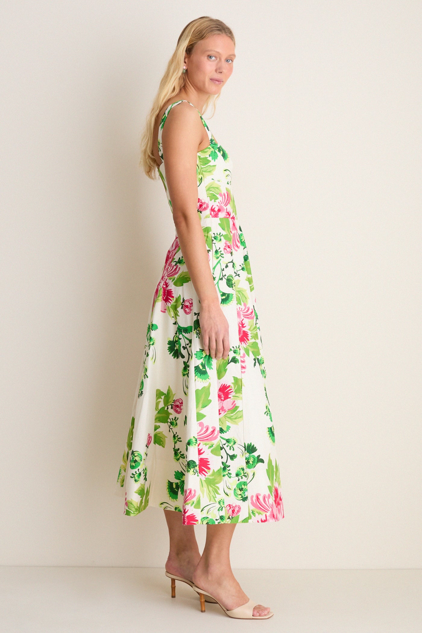 Saffier Bouquet Sabrina Midi Dress on a woman, showcasing a classic, effortless look with blooming florals, square neckline, and flared skirt, embodying high-end, fun elegance.