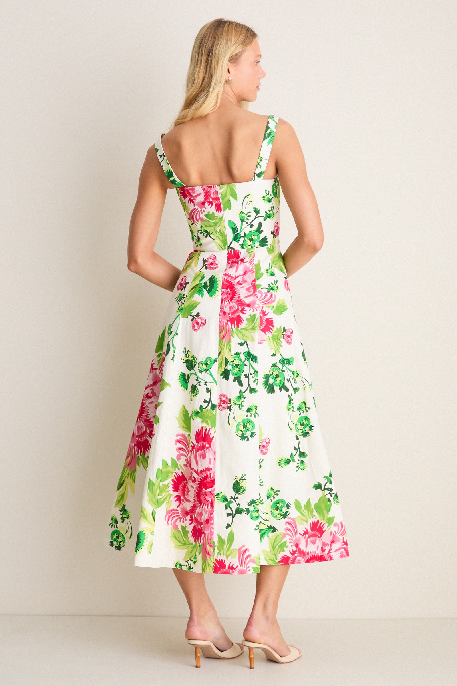 Saffier Bouquet Sabrina Midi Dress, a classic, effortless high-end piece with a square neckline, sleeveless fitted bodice, and flared skirt showing bold floral patterns.