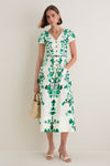 Saffier Vines Zoey-E Midi Dress exudes classic elegance with its green floral print, button-down front, and fitted waist, paired effortlessly with chic accessories for a high-end, fun look.