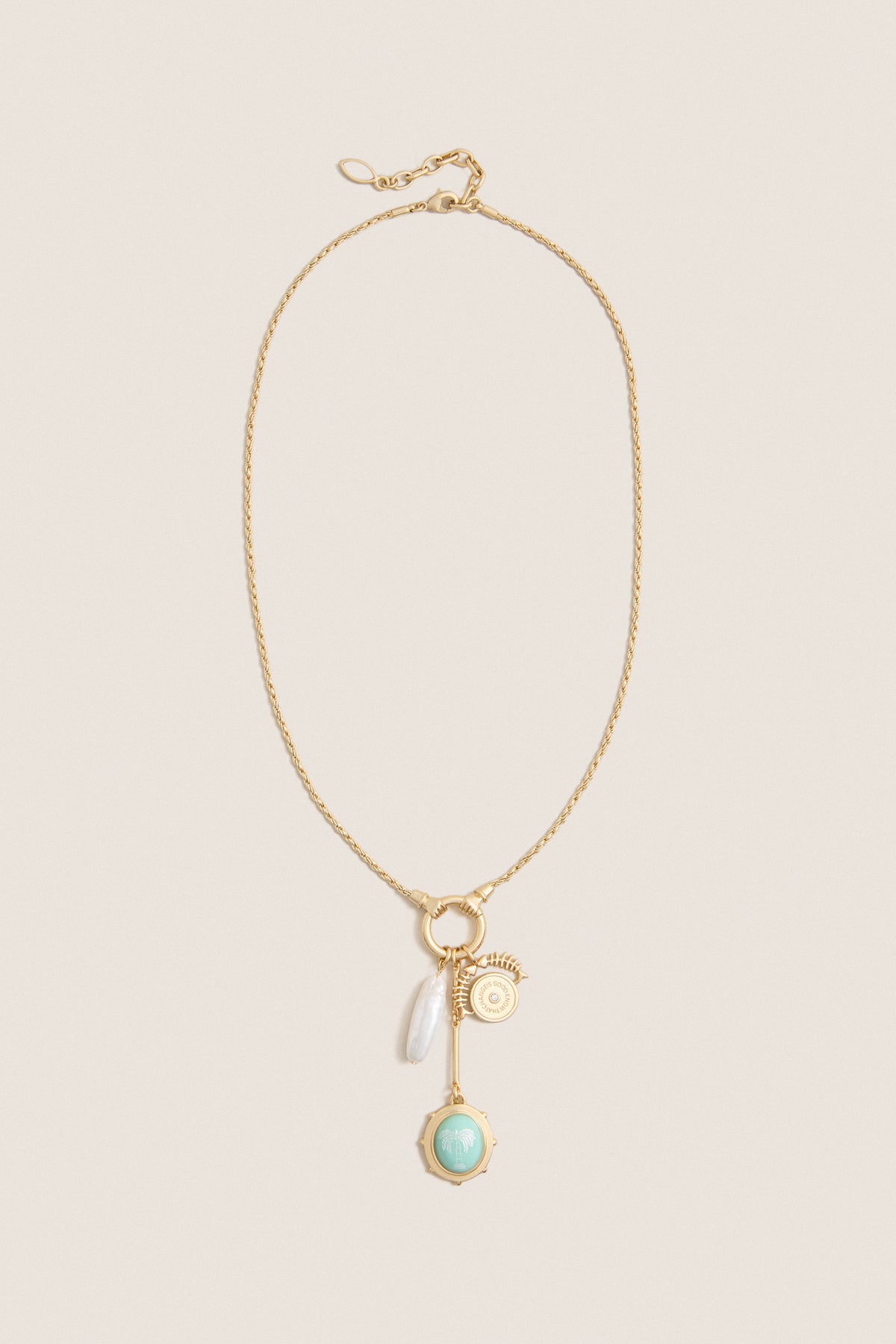 Gold Multi Frances Charm Necklace features a classic gold-tone chain with charms including a pearl drop, gold medallion, bar pendant, and mint-green palm-tree charm, offering effortless, high-end elegance.
