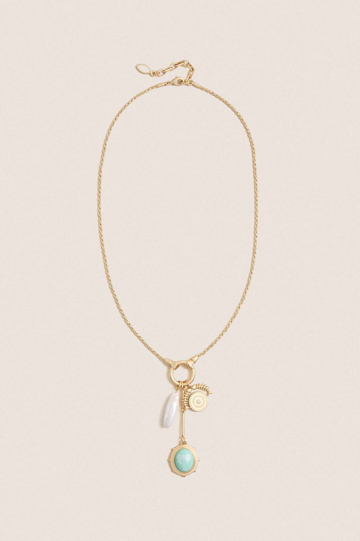 Gold Multi Frances Charm Necklace features a classic gold-tone chain with charms including a pearl drop, gold medallion, bar pendant, and mint-green palm-tree charm, offering effortless, high-end elegance.