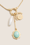 Gold Multi Frances Charm Necklace with a twisted rope chain, featuring eclectic charms like a baroque pearl, fish-bone motif, and mint-green cameo for an effortless, classic style.