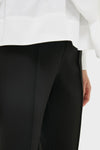 Close-up of Black Audrey Pants, showcasing a classic, slimming fit with a pinched seam. An effortless, high-end look for versatile, fun styling.