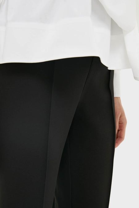 Close-up of Black Audrey Pants, showcasing a classic, slimming fit with a pinched seam. An effortless, high-end look for versatile, fun styling.