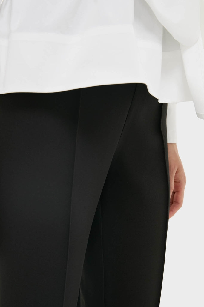 Close-up of Black Audrey Pants, showcasing a classic, slimming fit with a pinched seam. An effortless, high-end look for versatile, fun styling.