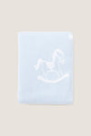 Blue Rocker Knit Blanket with classic rocking horse motif, crafted from ultra-soft cotton for an effortless and fun nursery touch. Ideal for high-end comfort.