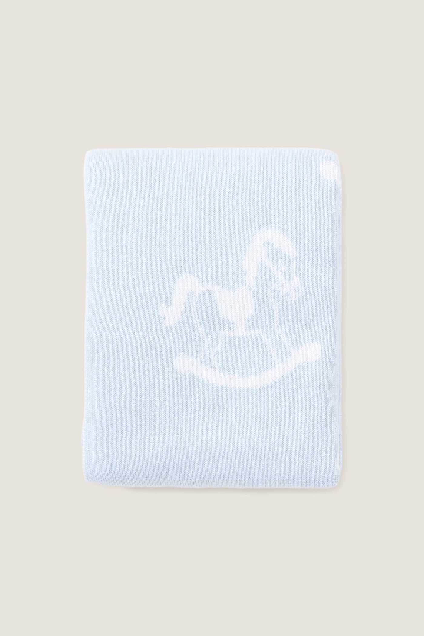 Blue Rocker Knit Blanket with classic rocking horse motif, crafted from ultra-soft cotton for an effortless and fun nursery touch. Ideal for high-end comfort.