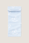 Blue Rocker Knit Blanket, a classic, ultra-soft cotton blanket featuring a playful white rocking-horse pattern on pale blue, perfect for effortless, high-end snuggling with your little one.