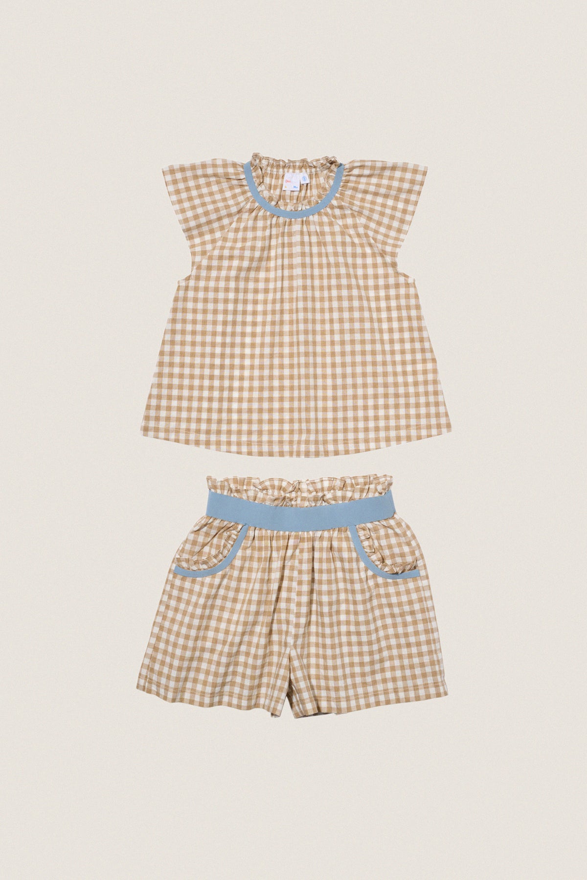 Camel Check Cecil Short Set: Classic gingham top and shorts, effortlessly chic with sky-blue accents. This fun, high-end outfit embodies easy, all-day comfort and style.
