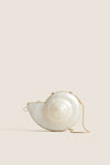 Pearl Marion Shell Clutch, a high-end, fun accessory with a nautilus shape, mother-of-pearl finish, gold trim, and chain, for an effortless, classic style.