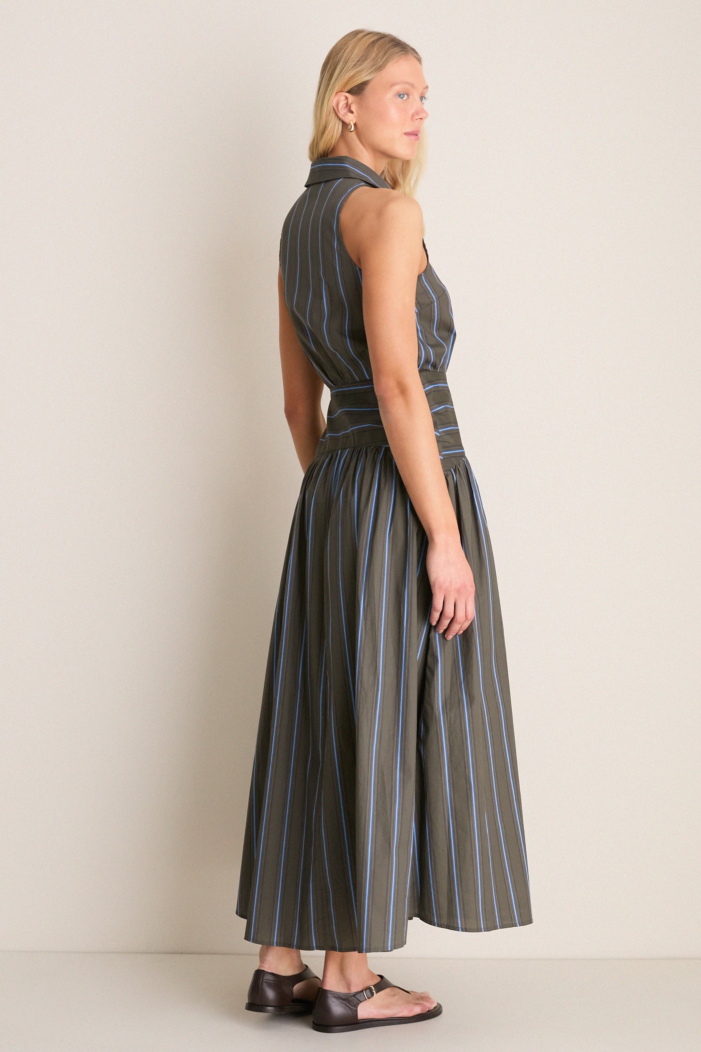 Huntington Stripe Romy Dress: A classic, sleeveless maxi with a collared neckline and button placket, offering an effortless, high-end style for fun day-to-night wear.