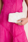 Model holds the classic Garden Party Carmella Beaded Clutch, featuring intricate floral beadwork, effortlessly chic for high-end occasions.