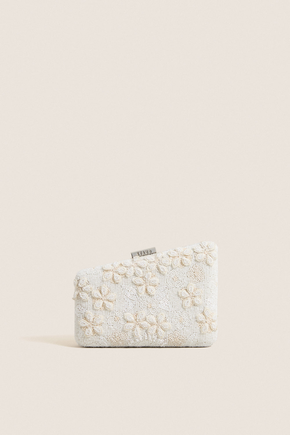 Garden Party Carmella Beaded Clutch, showcasing classic, high-end beadwork with floral motifs and effortless design, featuring a playful asymmetrical shape and removable chain strap.