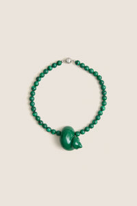 Green Mykonos Necklace: Classic malachite beads with an enamel animal-shaped pendant, silver clasp. Effortless, high-end design for fun, stylish outings.