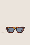 Brown Tortoise Dark Blue Lens Lori Sunglasses, featuring a classic cat-eye shape with a tortoiseshell frame, offer an effortless, high-end touch with a fun, modern twist.